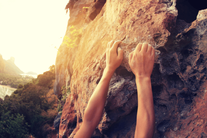 a photo of a person rock climbing